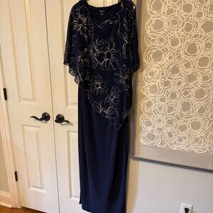 Ignite Evenings 3/4 Sleeve Asymmetrical Glitter Mesh Capelet V-Neck Jersey Gown